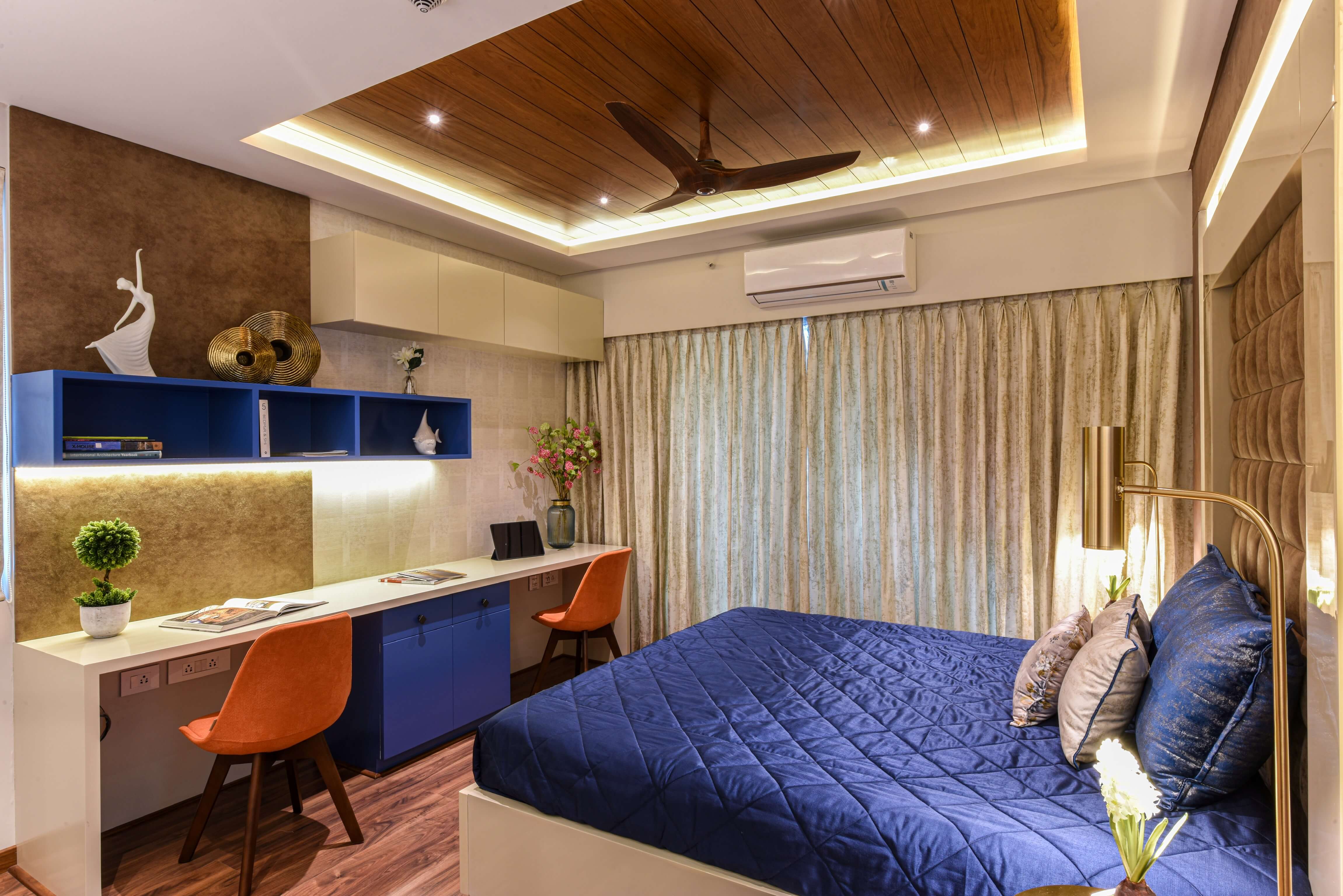 Bedroom interior with study desk and blue storage