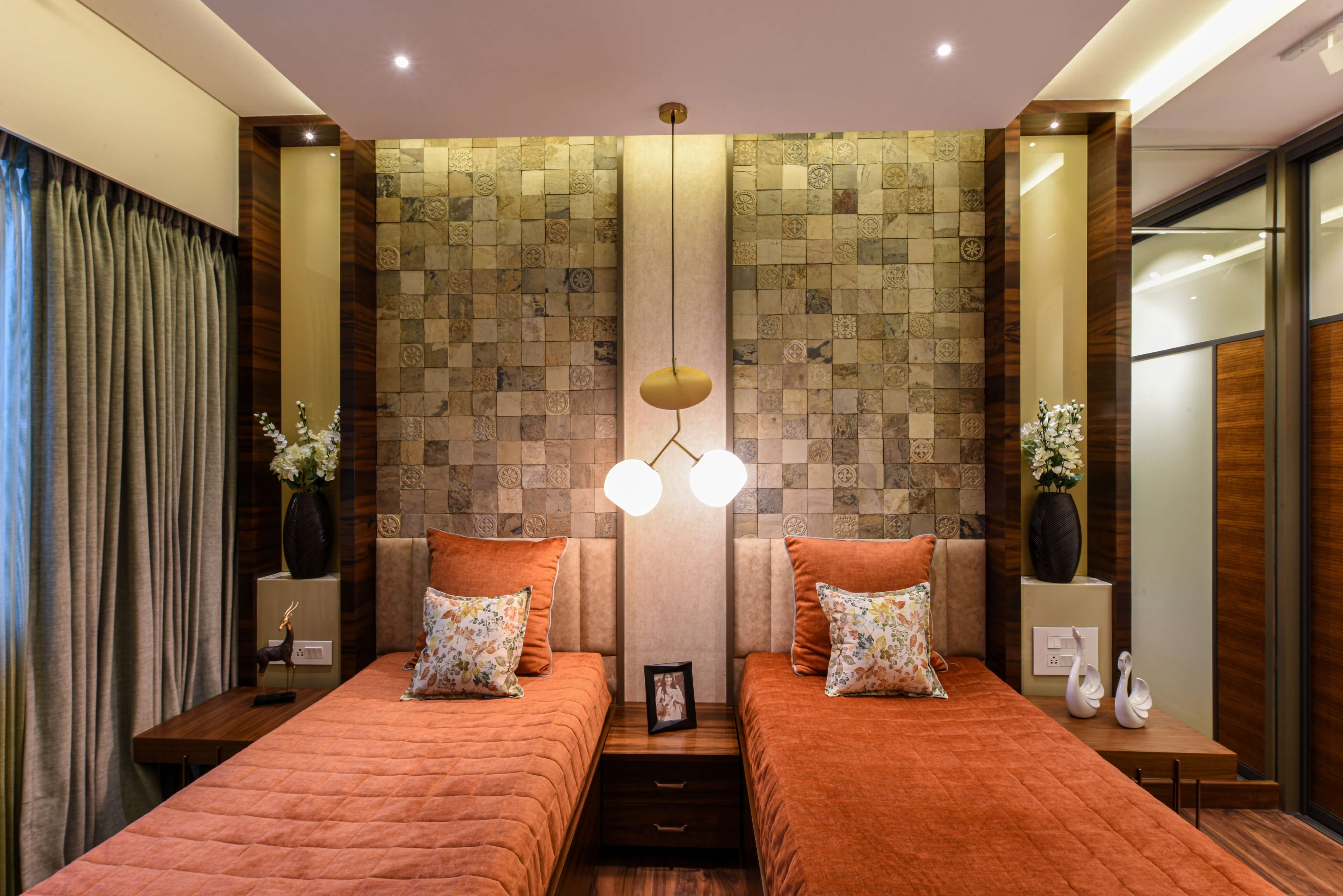 Twin bedroom with textured wall and warm lighting